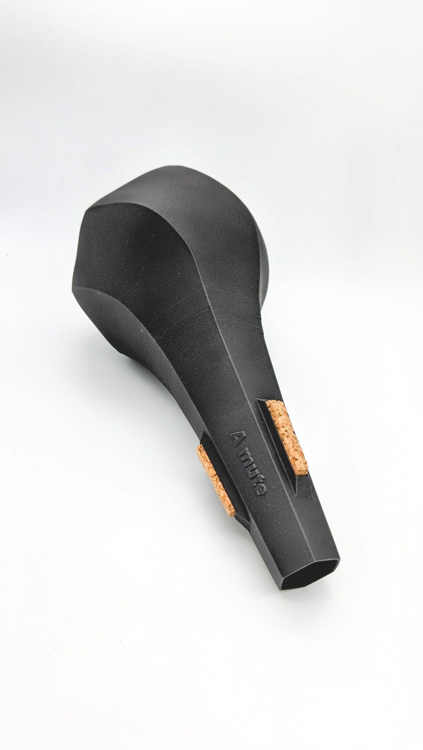 Detailed view of the A-Mute straight mute for flugelhorn with cork strips and matt black finish